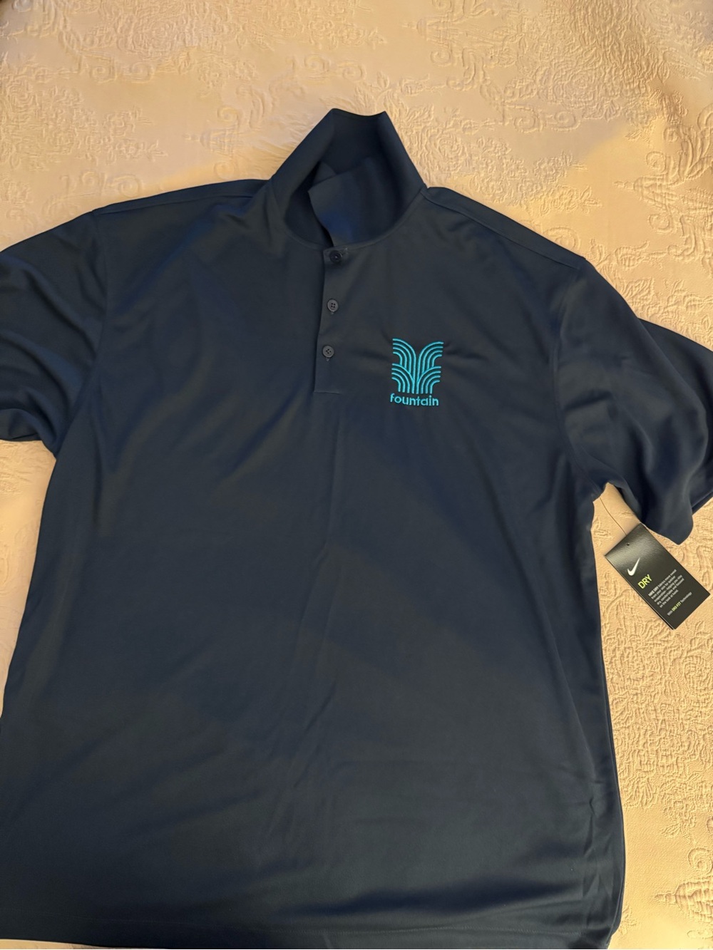Nike Navy Polo with Teal Fountain Logo